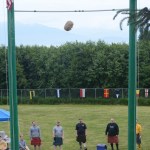 Max Sadtler tosses the sheaf as other athletes watch at the Kachemak Bay Celtic Club Scottish Highland Games last Saturday.-Photo by Michael Armstrong