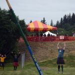 Matthew Patterson cheers as he flips the International Brotherhood of Electrical Works Local 1547 challenge caber — the first athlete in the history of the Kachemak Bay Celtic Club Highland Games to do so.
