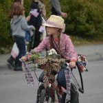 Emily Grimm, Alaska cowgirl, rides her decorated bike.-Photo by Michael Armstrong
