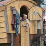 Otto Kilcher takes a bath in the Kilcher family’s “Alaska: the Last Frontier” float.-Photo by Michael Armstrong