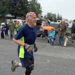 John Chapple III runs up Jefferson Street toward the base of the mountain in his first Mount Marathon race.