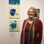Sharlene Cline shows off a set of three prints of her body parts at the opening of Bunnell Street Art Center’s 10x10 show on Nov. 20. A second opening for the general public will be held on Dec. 4.