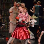 Aiyana Cline as Clara admires her new nutcracker in the ballet’s opening scene.-Photo by Annie Rosenthal