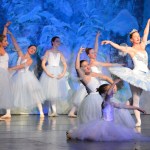 Snowflakes dance with their queen, played by Rhoslyn Jennings, in a rehearsal for the 27th Homer Nutcracker Ballet, which opens Saturday. From left, the snowflakes are Annalynn Brown, Sophie Morin, Lilli Heimbold, Katie Clark, Llena Bice, Ava Halstead and Ruby Allen.-Photo by Annie Rosenthal