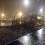 Wind of 63 knots last Tuesday blew a utility trailer loaded with crab pots from a parking lot on Fish Dock Road across the road and down an embankment into the harbor.-Photo by Matt Clarke, City of Homer/Port and Harbor