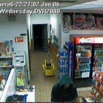 This screen capture of video footage taken at the Short Stop Tesoro gas station hows a man in a hoody at the counter.-Photo provided, Homer Police Department