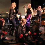 Kenai High School drumline members play the maracas as the elementary schoolers and Kenai Peninsula Orchestra members dance and play music that reflects the theme “The Orchestra Rocks.”-photo by Anna Frost