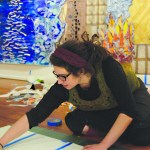 Desiree Hagen works on her installation, “Seven Years,” last Friday at Bunnell Street Arts Center.-Photo by Michael Armstrong, Homer News