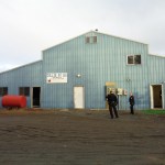 Homer Police officers stand outside a building on Collie Street where they seized about 1,000 cannabis plants on Feb. 12.-Photo provided, Homer Police Department