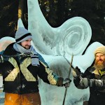 Barnabas Firth, left, and Ben Firth, right, pose in front of their first-place ice sculpture-Photo by Karen H. Clautice