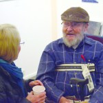 Toby Tyler visits at his show with Lisa Ellington. -Photo by Micheal Armstrong, Homer News