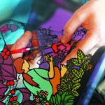 Valisa Higman cuts out part of an illustration for “My Coyote Nose and Ptarmigan Toes.”-Photo provided