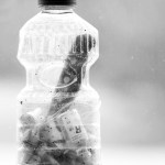 Syringe needles, a knife and a used bottle of insulin found on the beach by the Center for Alaskan Coastal Studies during an October 2014 beach clean-up with middle school students at Bishop’s Beach in Homer are displayed in a bottle. Ginny Espenshade keeps the bottle containing the needles as an educational visual aid.-Photo by Anna Frost, Homer News