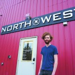 Jamin Bultman stands by the North West Signs shop at Bay Welding Services.-Photo by Michael Armstrong, Homer News
