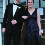 Chloe Loop and her date pose in front of the entrance to Land’s End Resort where Homer High School’s senior prom was held on April 9. Loop’s grandmother made her dress.-Photo by Anna Frost, Homer News