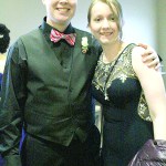 Zachary Nelson and Elise Weber pose before entering the prom on Saturday, April 9. Weber bought her dress in Chicago at Windsor when she was visiting her grandma and built his tux from items he owned. His bow tie is borrowed from choir director Kyle Schneider. “He’s got bow ties abounding,” said Nelson.-Photo by Anna Frost, Homer News