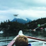 A photo taken by Dolores Wilber, a visitor from Chicago, shows Alice Rogoff's Cessna 206 as its starboard float falls into the water. The float appears to have come loose after the plane clipped a tree. Wilber took the photo from the Danny J.-Photo by Dolores Wilber