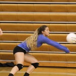 Varsity volleyball player Mary Hana Bowe lunges for the ball during a volleyball practice. Bowe is one of the few upperclassmen on the young varsity team this year and said her focus on preparing the freshmen and sophomores on the team to be a strong team over their next few years at Homer High.-Photo by Anna Frost, Homer News