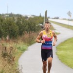 Mick Bakker runs down Spit Road back toward the high school, where he finished in first place.