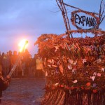 Mavis Muller, left, prepares to ignite this year's Burning Basket, Expand, on Sunday night at Mariner Park on the Spit.