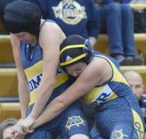 Homer's Alex Moseley tries to break free of Homer's Mina Cavasos on Saturday at the Luke Spruill Memorial Tournament at Kenai Central-Photo by Jeff Helminiak/Morris News Service - Alaska