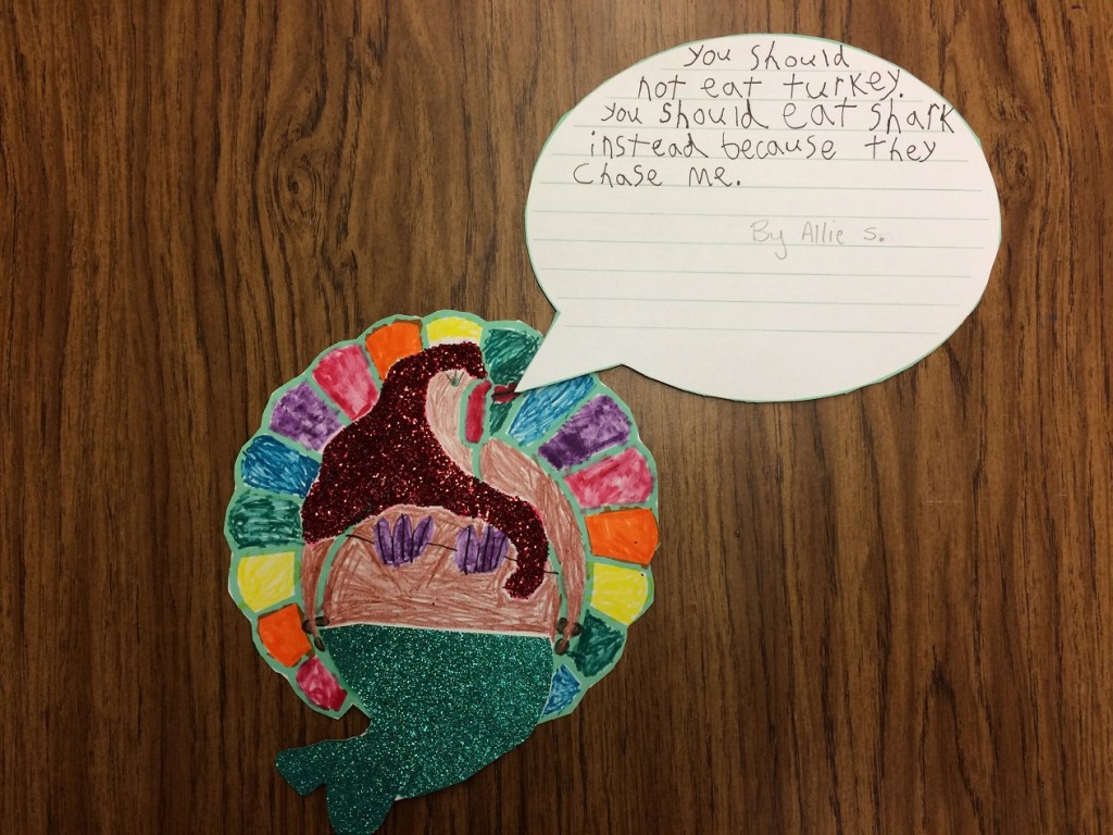 Allie S. disguised her turkey as a mermaid that tells people to eat shark instead of turkey because sharks chase mermaids.