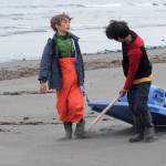Johannes Bynagle (left) and Gautama Iwamura, both homeschool students through the Kenai Peninsula Borough School District Connections program, tug a makeshift sled loaded with marine debris down the beach on Sunday, June 3, 2017 on Augustine Island, Alaska. The two were participants in a trip organized by the Homer-based nonprofit Center for Alaskan Coastal Studies to clean up debris along the beaches of the remote island in Cook Inlet. (Elizabeth Earl/Peninsula Clarion)  Johannes Bynagle (left) and Gautama Iwamura, both homeschool students through the Kenai Peninsula Borough School District Connections program, tug a makeshift sled loaded with marine debris down the beach on Sunday on Augustine Island. The two were participants in a trip organized by the Homer-based nonprofit Center for Alaskan Coastal Studies to clean up debris along the beaches of the remote island in Cook Inlet. (Elizabeth Earl/Peninsula Clarion)