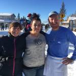 Michelle Wilson, left, Leah Tufares, center, and Sean Hogan, far right, stand in front of Cosmic Kitchen, the popular Homer eatery on Pioneer Avenue. (Photos provided)