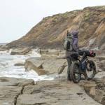 Kim McNett looks at a stretch of beach that has run out. (Photo courtesy Bjørn Olson)