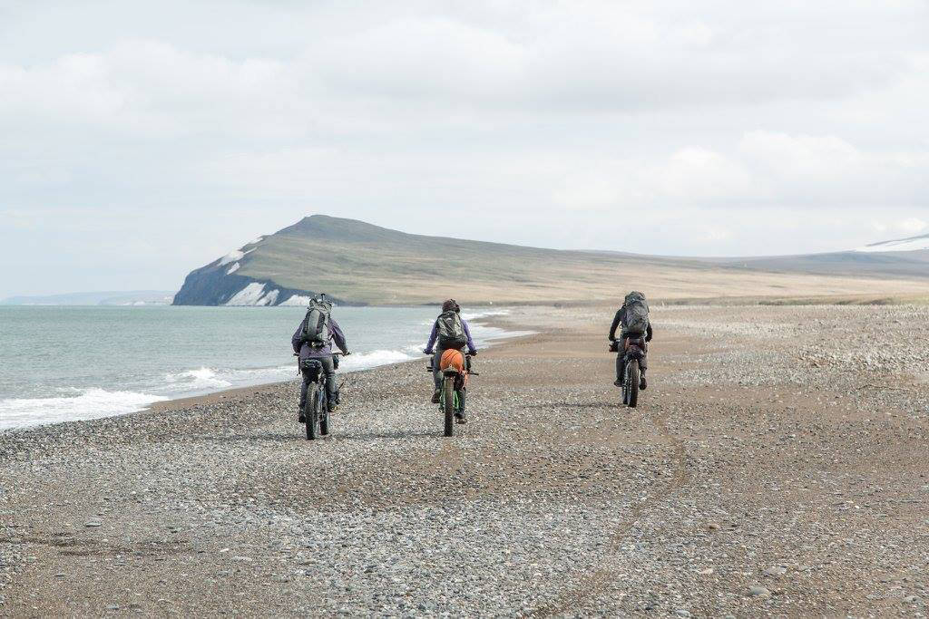 The group heads north on a firm beach &mdash; perfect riding conditions for fat bikes. (Photo courtesy Bjørn Olson)