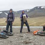 Alayne Tetor, right, holds a walrus skull she found on the beach on the way to Point Lay. Kim McNett is at left. (Photo courtesy Bjørn Olson)
