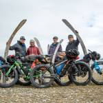 The Roof of the Arctic group pose for a photo next to whale jaws. From left to right are Bjørn Olson, Alayne Tetor, Kim McNett and Daniel Countiss. (Photo courtesy Bjørn Olson)