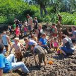 Photo by Megan Pacer/Homer News Kids and parents wade through copious amounts of mud in a pit specially prepared for this year&rsquo;s Mud Wallow on Saturday, July 22, 2017 at Cottonwood Horse Park in Homer, Alaska.