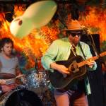 Zil Fessler, left, and Michael Glabicki of Rusted Root perform on Saturday night, Aug. 5, 2017, at Salmonfest, Ninilchik, Alaska. A balloon bounces over the crowd. (Photo by Michael Armstrong, Homer News)