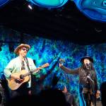 Zil Fessler, far left, Michael Glabicki, left, Liz Berlin, center, and Dirk Miller, right, of Rusted Root perform on Saturday night, Aug. 5, 2017, at Salmonfest, Ninilchik, Alaska. (Photo by Michael Armstrong, Homer News)