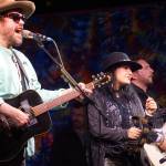 Michael Glabicki, left, Liz Berlin, center, and Dirk Miller, right, of Rusted Root perform on Saturday night, Aug. 5, 2017, at Salmonfest, Ninilchik, Alaska. (Photo by Michael Armstrong, Homer News)