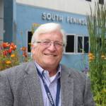 South Peninsula Hospital CEO Robert Letson poses for a photo in front of the hospital&rsquo;s Bartlett Street entrance on July 9, 2016, for SPH&rsquo;s 60th Anniversary Party. (Homer News file photo, Anna Frost)