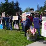 People demonstrating against the events of Charlottesville, Va., and other white supremacist rallies stand up against racism at WKFL Park in Homer on Sunday afternoon. About 50 people attended the one-hour event held from 3-4 p.m. Sunday, Aug. 13, 2017 in Homer, Alaska. (Photo by Michael Armstrong, Homer News)