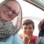 Christina Whiting and a 6-year-old boy named Amad she met during her travels pose for a picture in 2015 in Jordan. (Photo courtesy Christina Whiting)