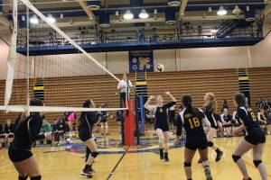 Members of the Homer Mariners varsity volleyball team take on Kenai Central High School during one of their final games during the Homer Jamboree on Saturday, Aug. 19, 2017 at Homer High School in Homer, Alaska. The team took fourth in the round robin event, just behind Kenai, whose team came in third. (Photo by Megan Pacer/Homer News)