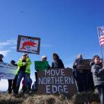 About 25 protesters with the Kachemak Bay Conservation Society and the Eyak Preservation Council greet the USS Hopper as she arrived at the Deep Water Dock on the Homer Spit about noon Saturday, April 29, 2017. A crowd of about 200 people greeted the Arleigh-Burke class destroyer on the beach as it arrived in Alaska and about 200 more greeted the ship at the Deep Water Dock. A minus 4.6 low tide at 11:37 a.m. and the wrong dock face prevented Hopper from docking at the Deep Water Dock as planned, and she was to attempt docking later in the afternoon. (Photo by Michael Armstrong/Homer News)