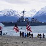 A crowd of about 200 people greeted USS Hopper as she rounded Coal Point at the end of the Homer Spit about noon Saturday, April 29, 2017, as the Arleigh-Burke class destroyer arrived in Alaska. Local veterans groups and the Homer Downtown Rotary Club provided U.S. flags placed on the beach. A minus 4.6 low tide at 11:37 a.m. and the wrong dock face prevented Hopper from docking at the Deep Water Dock as planned, and she was to attempt docking later in the afternoon. (Photo by Michael Armstrong/Homer News)