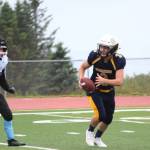 Senior Dawson Felde runs with the ball during Saturday&rsquo;s game between the varsity Homer Mariners football and Valdez High School on Aug. 26, 2017 at the Mariner field in Homer, Alaska. Homer was victorious over Valdez 66-0. (Photo by Megan Pacer/Homer News)