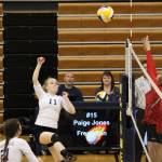 Sophomore Audrey Wallace hits the ball over the net to the Kenai Central High School Cardinals during their game Tuesday, Aug. 29, 2017 at Homer High School in Homer, Alaska. It was the first home game for the Mariners, who won the non-conference match 3-0. (Photo by Megan Pacer/Homer News)
