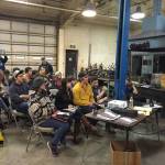 Sunny Puterbaugh, seated center and wearing a hat, was a Homer High School senior in January 2015 when she attended one of the school&rsquo;s first FOL, Focus On Learning, sessions. It was taught by Mike Stockburger, standing, of the Homer Marine Trades Association. Puterbaugh was later hired by South Central Radar and trained in radio programming, repair and installation. (Photo provided)
