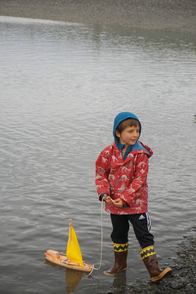 Ike Mitchell runs sea trials on a boat he made during the Kachemak Bay Wooden Boat Society Festival on Saturday, Sept. 2, 2017 at the Nick Dudiak Fishing Lagoon campground in Homer, Alaska. (Photo by Michael Armstrong, Homer News)