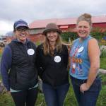 From left to right, Jessie Turner, Lacey Velsko and Renee Alward represent the commercial fishing industry at the North Pacific Fisheries Association Fish Fry last Saturday, Sept. 2, 2017 at the Kachemak Bay Wooden Boat Society festival on the Homer Spit. (Photo by Michael Armstrong, Homer News)