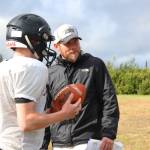 Justin Zank, head coach of the Cougars football team, looks on during a practice Friday, Sept. 1, 2017 at McNeil Canyon Elementary in Fritz Creek, Alaska. Zank, with help from the school district and administration, brought the players from Russian Old Believer schools Voznesenka, Razdolna and Kachemak-Selo from an eight-man team to a varsity 11-man program five years ago. (Photo by Megan Pacer/Homer News)
