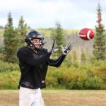 Kalinik Reutov, a junior, catches a ball during a Cougars team practice Friday, Sept. 1, 2017 at McNeil Canyon Elementary in Fritz Creek, Alaska. The team made up of players from three Russian Old Believe schools outside Homer is in its fifth year as an 11-man program. (Photo by Megan Pacer/Homer News)