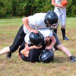 Players on the Cougars football team, made up of students from the Russian Old Believer schools Voznesenka, Razdolna and Kachemak-Selo, goof around during an exercise at a team practice Friday, Sept. 1, 2017 at McNeil Canyon Elementary in Fritz Creek, Alaska. With two seniors and several juniors who have been with the team since they entered high school, Head Coach Justin Zank said this year&rsquo;s is the most experienced group of players he&rsquo;s had since the 11-man program started five years ago. (Photo by Megan Pacer/Homer News)